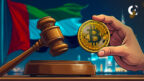 News report on the Abu Dhabi Judicial Department accepting payments in the AE Coin stablecoin for court services in 2025.